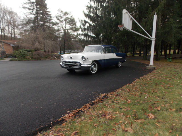 1955 Oldsmobile Super 88. 2 door sedan. Dark blue and white with grey interior. 1955 Oldsmobile Eighty-Eight Super 88