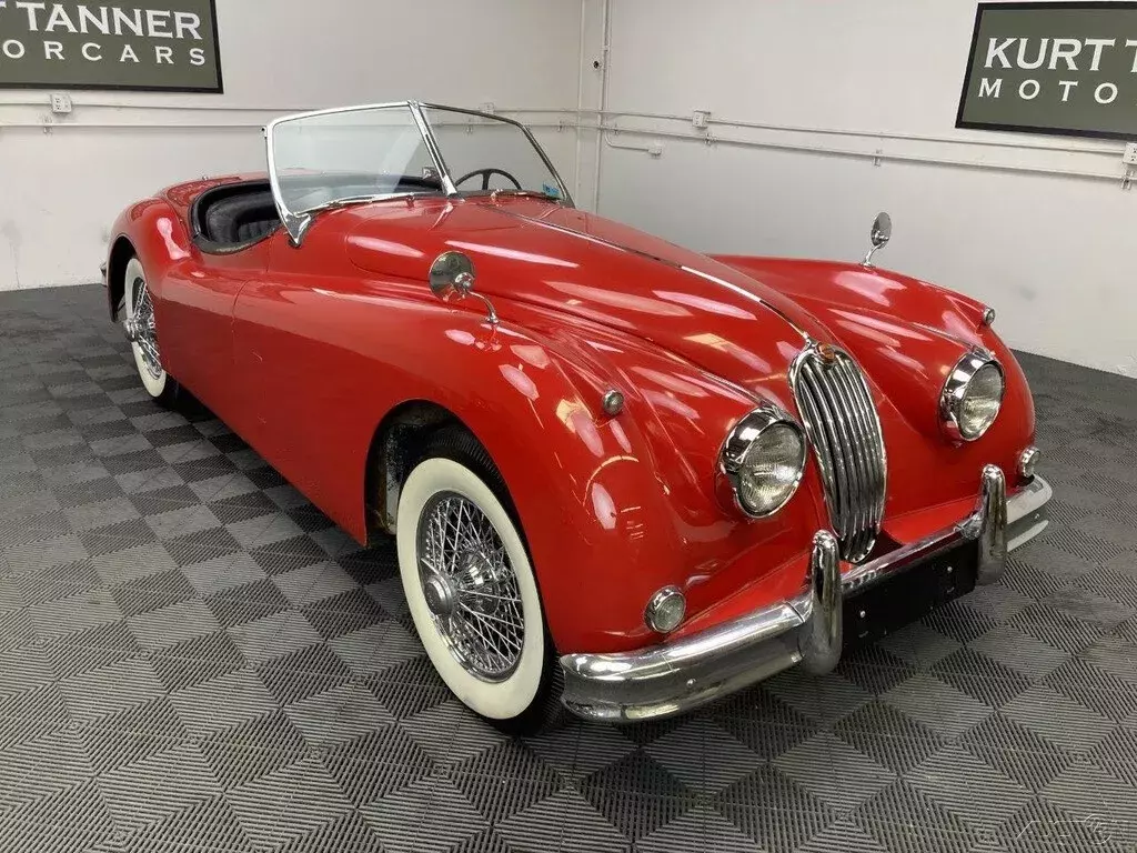 1957 JAGUAR XK140 ROADSTER. OTS. HIGHLY ORIGINAL, CAR WITH 49,300 MILES. 1957 Jaguar XK 1957 JAGUAR XK140 ROADSTER. OTS. CARMEN RED
