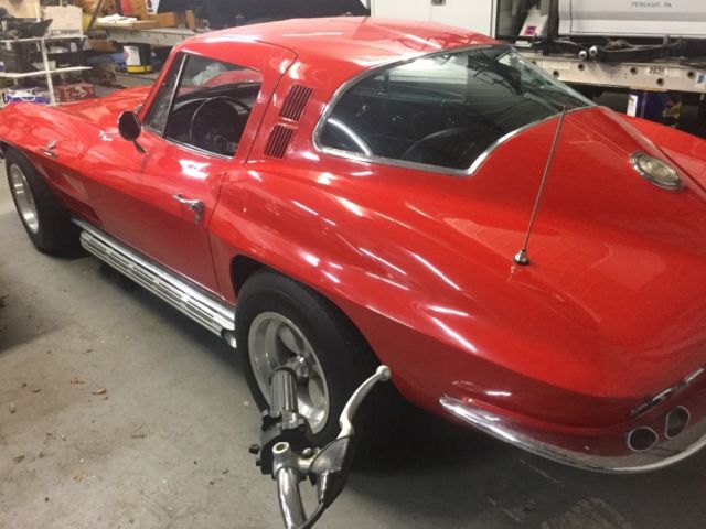 1964 corvette Stingray Fastback 4 speed red black antique car factory side pipe 1964 Chevrolet Corvette