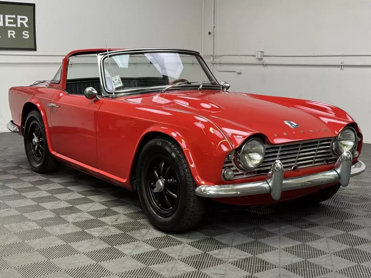 1964 TRIUMPH TR4 SURREY TOP CONVERTIBLE. SIGNAL RED WITH BLACK LEATHER TRIM 1964 Triumph TR4
