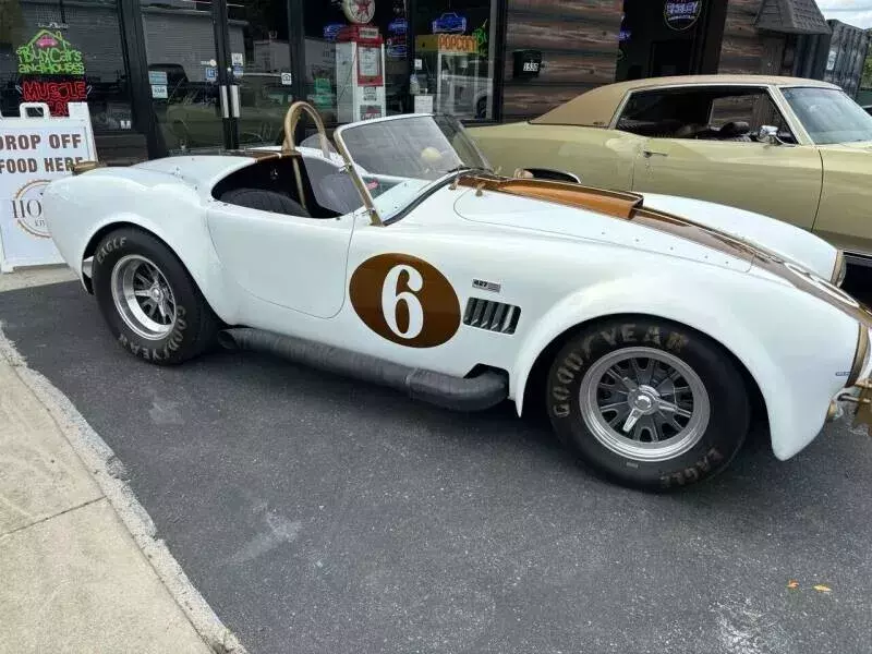 1965 Superformance Cobra with pearl white and gold racing stripes 1965 Shelby Cobra