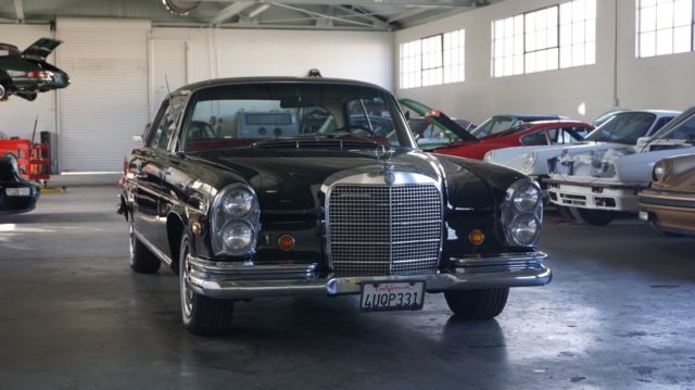 1969 Mercedes 280SE Coupe Black on red. 1969 Mercedes-Benz 200-Series