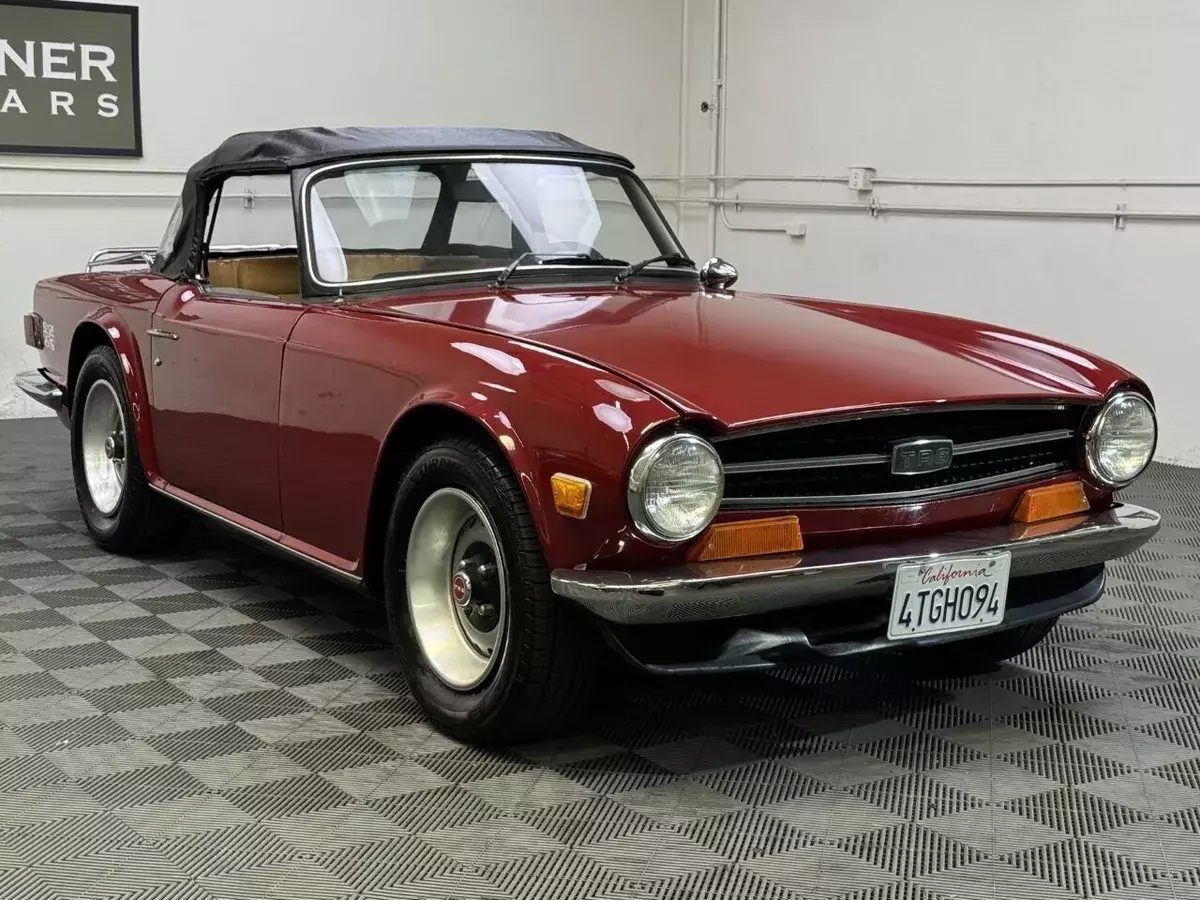 1973 TRIUMPH TR6 CONVERTIBLE. CARMINE RED WITH BISCUIT LEATHER TRIM, BLACK TOP 1973 Triumph TR-6