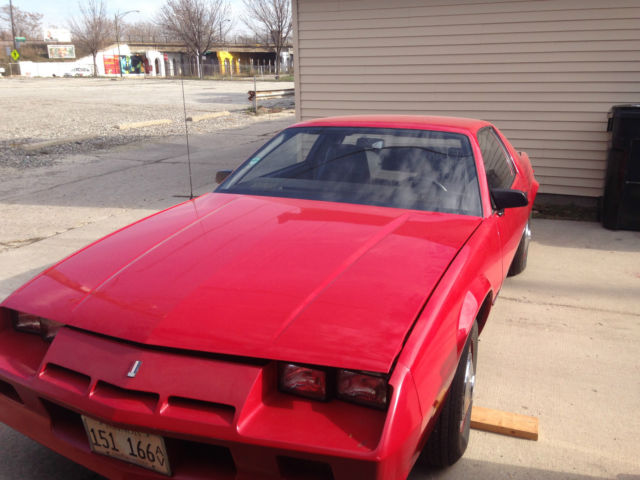 1983 Chevrolet Red Camero 4-speed,bucket seats, 4 cyl., 5,400 original miles. 1983 Chevrolet Camaro
