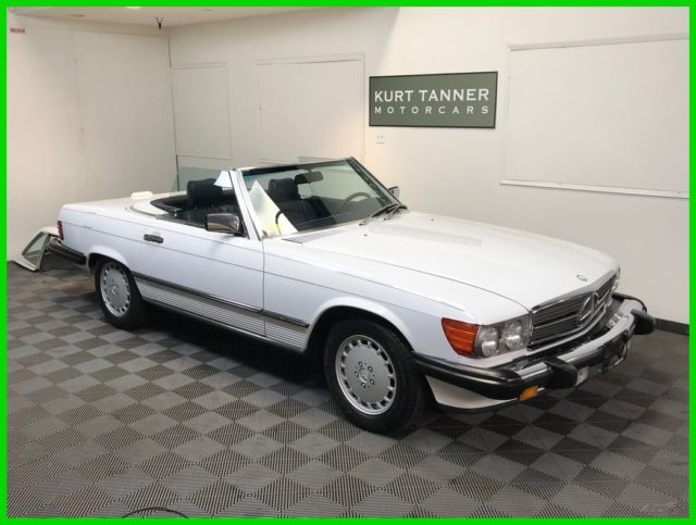 1988 MERCEDES BENZ 560 SL. ERY NICE RUNNING AND DRIVING CAR. EXCELLENT OVERALL. 1988 Mercedes-Benz 500-Series ARCTIC WHITE WITH BLUE TRIM AND SOFT TOP