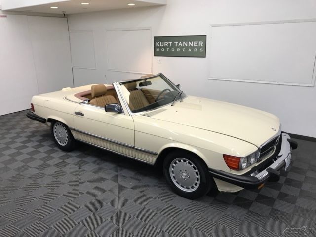 1988 MERCEDES BENZ 560 SL. LIGHT IVORY WITH PALOMINO TRIM. DARK BROWN SOFT TOP. 1988 Mercedes-Benz SL-Class 104,384 MILES. NICE DRIVING CAR.