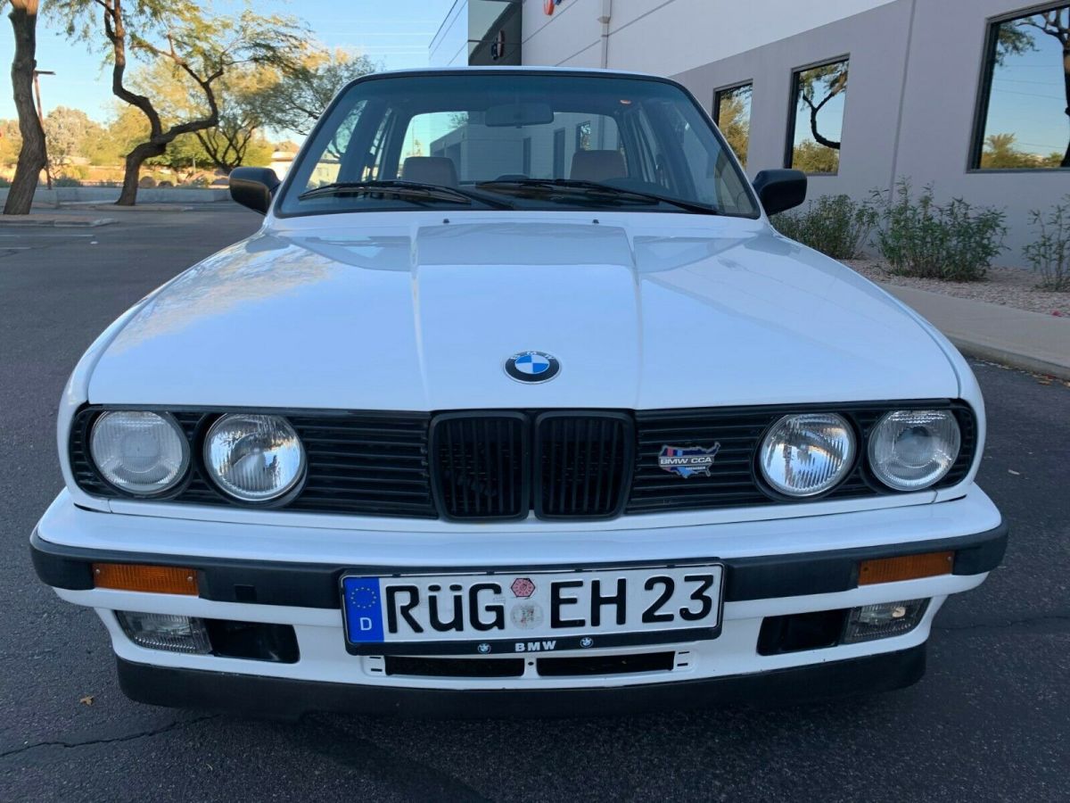 1990 BMW 325i E30 Sedan with E39 M5 S62 4.9L V8 engine swap in Alpine White 2 1990 BMW 3-Series