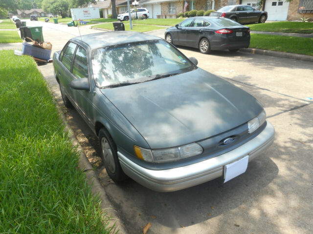 1992 Ford Taurus (Flooded Twice) Sold AS-IS 1992 Ford Taurus Grey