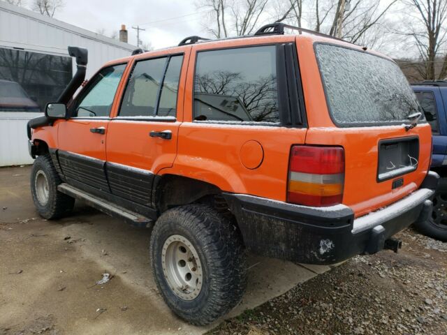 1993 ORANGE JEEP GRAND CHEROKEE!!! NO RESERVE!!! SEE OUR OTHER NR AUCTIONS!!! 1993 Jeep Grand Cherokee