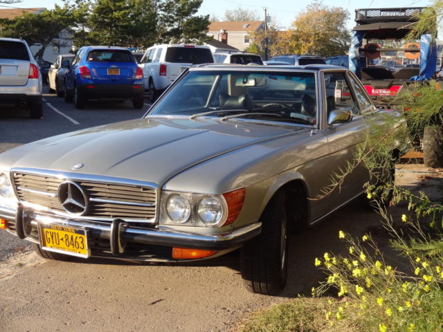 350 sl silver -black hard and rag top, with book claiming to be first of series 1973 Mercedes-Benz SL-Class soft and hard top convertible