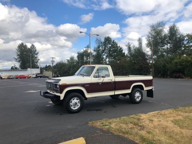 burgundy and white Ford Pickup f-250 with 103,318 Miles 4x4 1985 Ford Other Pickups --