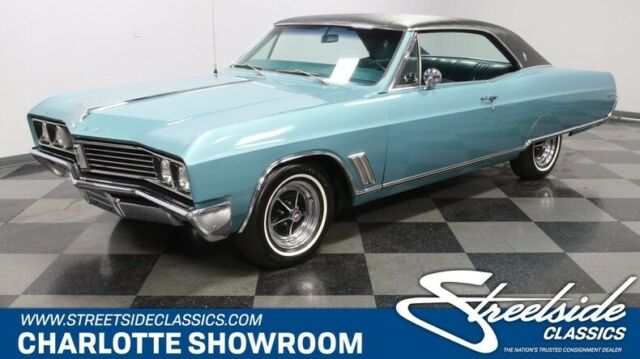 classic vintage chrome aqua blue black vinyl top white wall tires 1967 Buick Skylark --