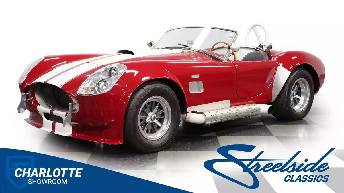 classic vintage side pipes roadster race car knock off wheels 1967 Shelby Cobra Unique Motorcars