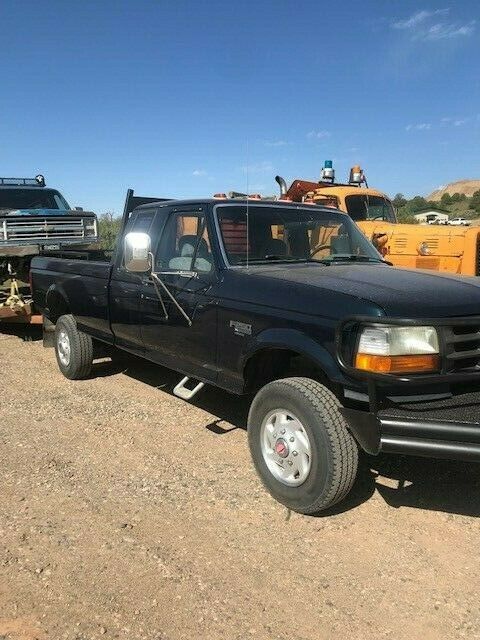 Green 1994 Ford F-250 2 Door Extended Cab 4WD Pickup 7.3L V8 OHV 16V Diesel 1994 Ford F-250 HD XL SuperCab 4WD
