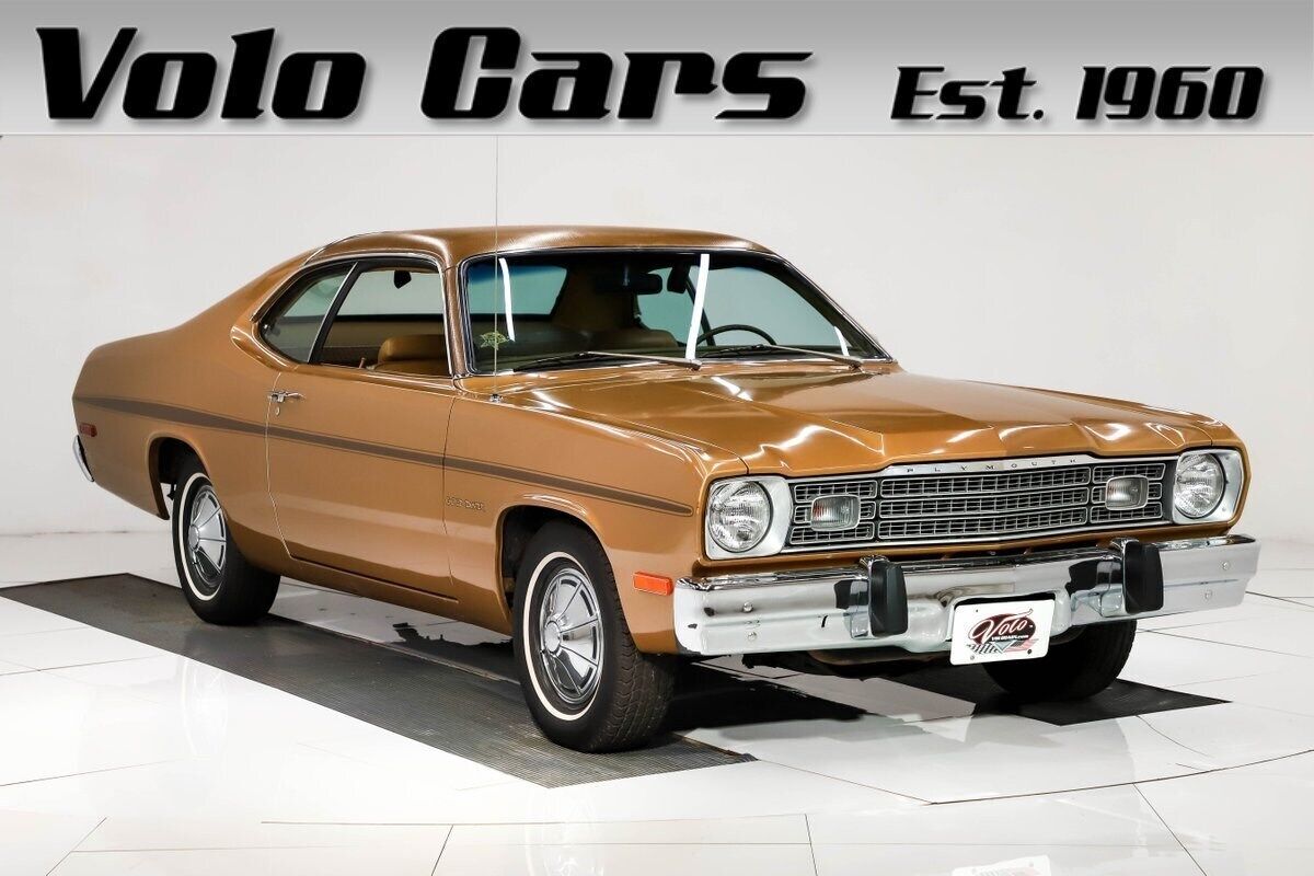 Highlight: 20,560 miles. Factory snake skin top! Air, ps, pdb. 1973 Plymouth Gold Duster