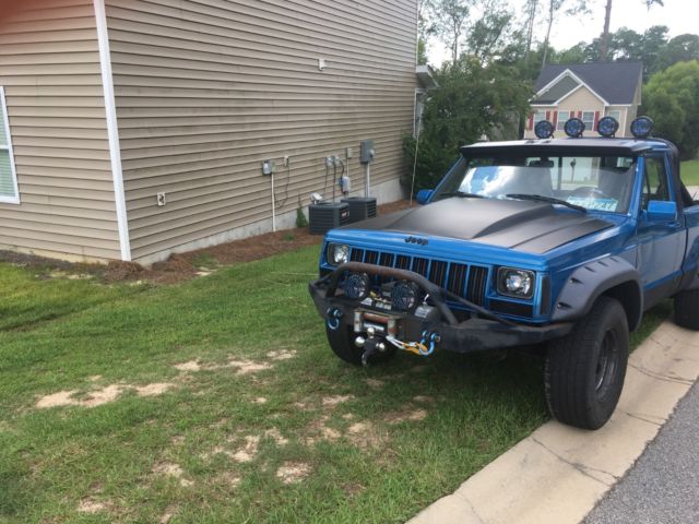 Jeep Comanche Pickup 4x4 Blue and Black mud truck custom 1988 Jeep Comanche pioneer