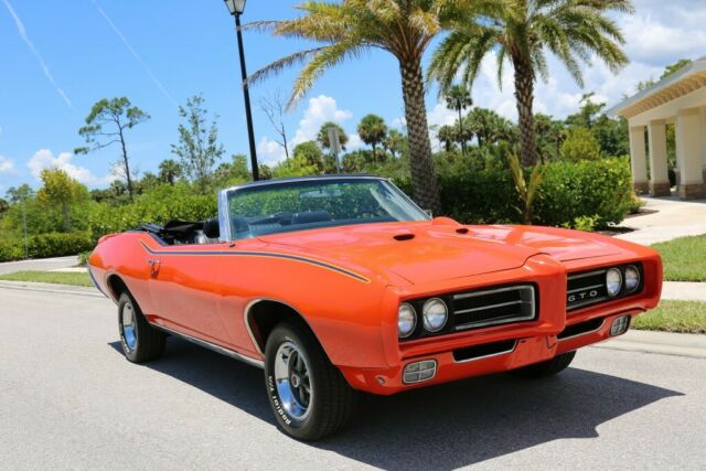 “Real 242” 1969 GTO Convertible In Carousel Red with Judge Graphics. 1969 Pontiac GTO Convertible