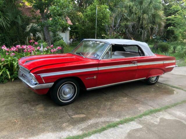 This here is a 1962 Oldsmobile cutlass F-85 Convertible equipped with an old all 1962 Oldsmobile Cutlass Original