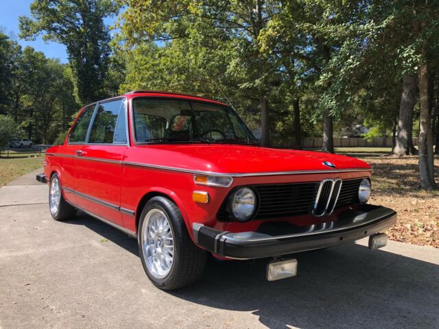 Verona red 1976 BMW 2002 with 5-speed, sport suspension and other upgrades. 1976 BMW 2002