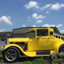 1928 Model A Ford coupe, all steel car, bright yellow