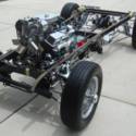 1930 Model A Ford 5 window coupe on a chromed Jaguar XKE suspension. 305 Chevy.
