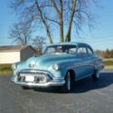 1951 Buick Special 2 door sedan ----------- Blue with Wide white wall tires .