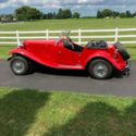 1952 MG-TD Replicar Convertible with red exterior and a black interior.