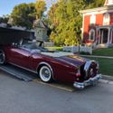 1953 Packard Caribbean with 2000 Ford F-250 and 1999 We Hauler