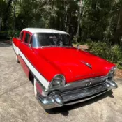 1956 RED PACKARD CLIPPER CAR, RUNS BUT NEEDS WORK.  NICE INTERIOR FAIR EXTERIOR.