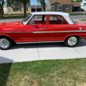 1962 Chevy Nova Four Door Red 16,600 original miles-very nice,very solid