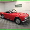 1962 TRIUMPH TR-4. EARLY PRODUCTION. EXCELLENT OLDER RESTORATION. DRIVES SUPERB.