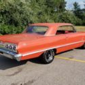 1963 CHEVROLET IMPALA V-8 SMALL BLOCK 4 SPEED TRANSMISSION.  RED ON RED