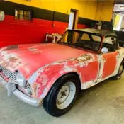 1963 Triumph tr4  orange  Manual 999,999 Miles