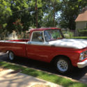 1964 Ford F-100 Custom Cab pickup truck long bed red white