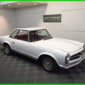 1964 MERCEDES 230SL CONVERTIBLE. WHITE WITH RED TRIM. RUNNING AND DRIVING.
