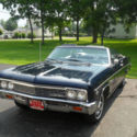 1966 Chevrolet Impala Convertible, midnight blue, black interior, white top.