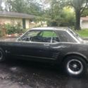 1966 Ford Mustang Coup with Eleanor paint with black stripes.