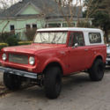 1967 International Scout 800; red, lifted, new wrangler tires & pacer rims