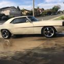 1969 Chevrolet Camaro resto-mod cream color, black and red stripe