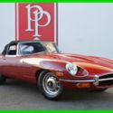 1969 Jaguar E-Type Roadster, 4.2L 6 Cyl, 4-sp MT, Red on Black 77k miles.
