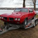 1970 Pontiac GTO with RAIV top end. Red 4-spd. Frame Off Restored.