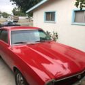 1970 red Ford Maverick