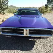 1972 Charger with purple paint job and black vinyl top is restored from frame up