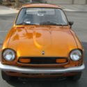 1972 Honda Z600 2 cylinder 4 speed manual transmission orange/gold, 50 mpg.