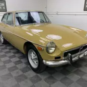 1973 MGB GT. HARVEST GOLD, VERY DARK BLUE TRIM.  NEEDS SOME EASY ASSEMBLY.