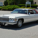 1974 Cadillac Coupe Deville with only 12,500 miles in new condition.
