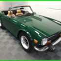 1974 TRIUMPH TR-6. BRG. RESTORED CAR IN GOOD COLORS WITH GREAT MECHANICALS.