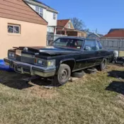 1979 Black Cadillac DeVille with Red Interior