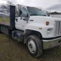 1984 GMC Top Kick Cat 3116 powered 6 sp. Flat bed w/ stakes. Good tires
