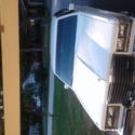 1985 cadillac seville buskelback  white exterior with silver trim.